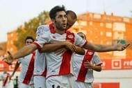 MADRID, SPAIN - AUGUST 19:  Alberto Perea of Rayo Vallecano de Madrid celebrates scoring their second goal with teammates during the La Liga match between Rayo Vallecano de Madrid and Elche FC at Estadio Teresa Rivero on August 19, 2013 in Madrid, Spain.  (Photo by Gonzalo Arroyo Moreno/Getty Images)